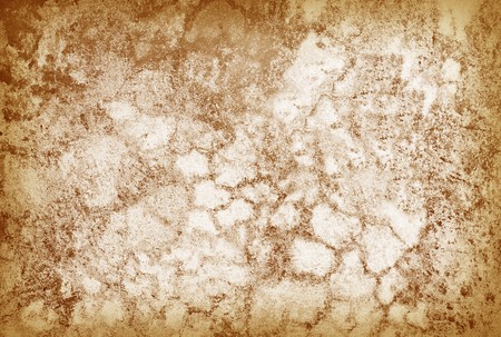 The old cracked grunge surface of a brown wall - a backgroundの写真素材