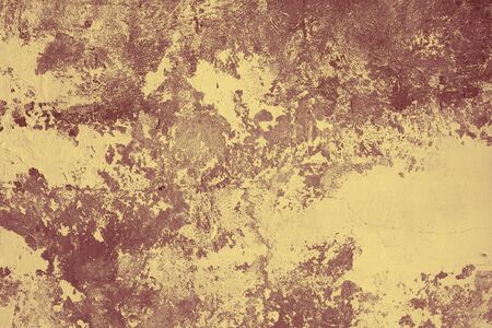 Fragment of a surface of a concrete wall with stains of an old paintの写真素材