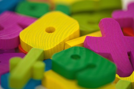 Some wooden color toys extreme close upの写真素材