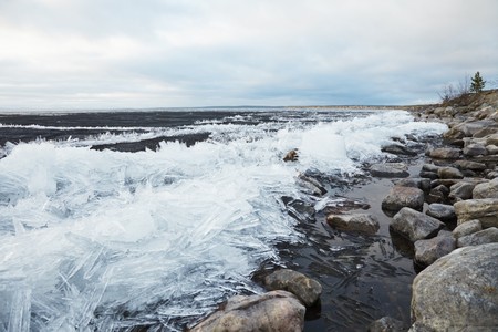 Heaps of ice on the bank of northern lake - Imandraの写真素材