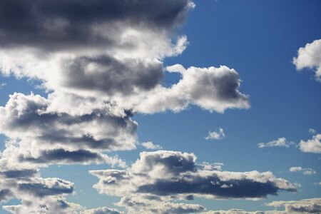 Cloudy evening summer contrasting blue skyの写真素材