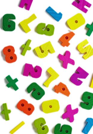 Antique Toy colored wooden figures scattered on a white backgroundの写真素材