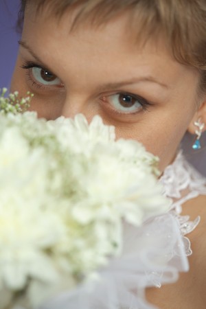 Portrait of a bride with a bouquet - eyes closeupの写真素材