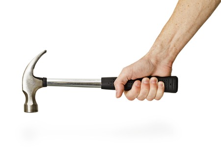The hand holding the hammer isolated on a white backgroundの写真素材