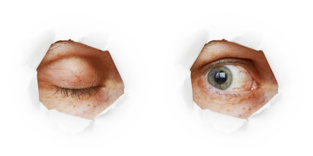 Eye in a hole - the closed and open variants on white backgroundの写真素材