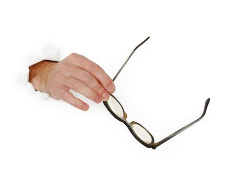 Hand holds glasses isolated on white backgroundの写真素材