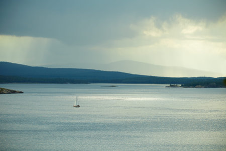 Small lonely yacht against the evening sea