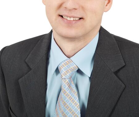 Smiling young businessman with a tie closeupの写真素材