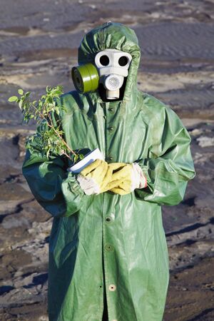 The Scientific Environmentalist gently hugs a small treeの写真素材