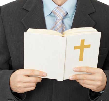 A man reads the Catholic Bible - closeupの写真素材