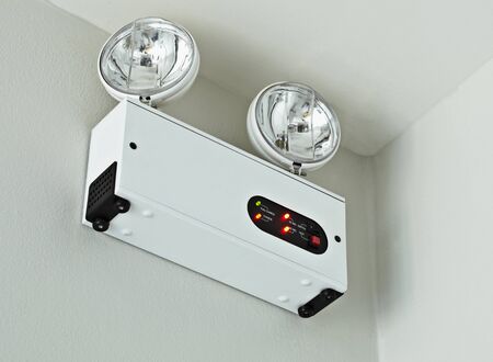 A device for alarm mounted on the wall in the roomの写真素材