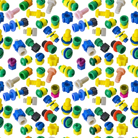 Seamless texture - color toy nuts and bolts on whiteの写真素材
