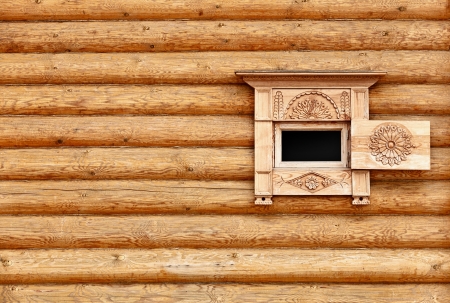 Vintage wooden wall with small window - the backgroundの写真素材