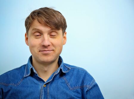 Dreaming a man with a satisfied look on his faceの写真素材