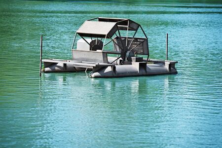 Chai Pattana aerator on clean blue lake water. Thailand, Bangkokの写真素材