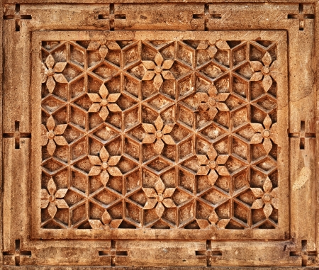 Floral ornament on orange limestone stone wall in Jaisalmer, Rajasthan styleの写真素材