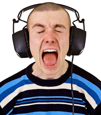 Shout at the top of his voice male music lover with big headphones isolated on white backgroundの写真素材
