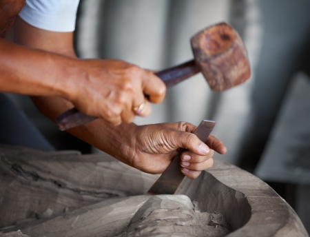 Hands woodcarver while working with the toolsの写真素材