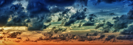 Panoramic view of evening dramatic saturated color sky at sunset
