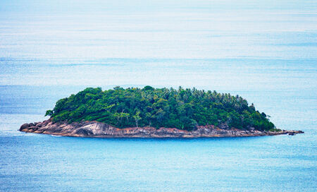 A small island in the open tropical seaの写真素材