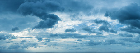 Panorama of beautiful cloudy sky over the sea horizon