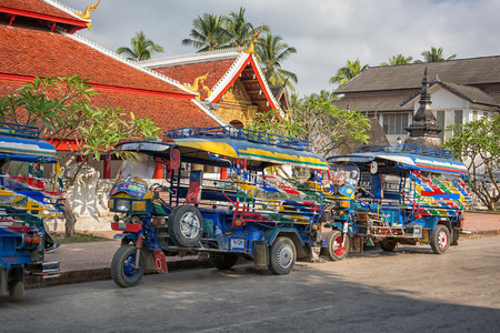 LUANG PRABANG, LAOS - CIRCA DEC 2013: taxi tuk-tuk in the streetsのeditorial素材