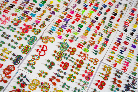 Laos - colorful jewelery for sale. On the white background. Handmade Earringsの写真素材