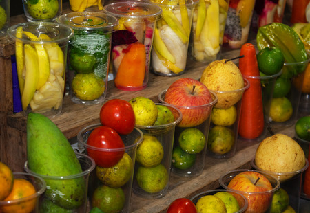 Laos - fruits on the counter merchant fruit juices. Fresh fruitsの写真素材