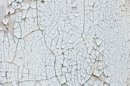 Old wall with white peeling paint. Grunge vintage backgroundの写真素材