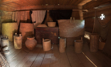 Ukraine, dark old wooden barn with utensil. Interiorの写真素材