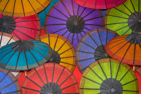 Colored paper Traditional vintage umbrellas on the counter of the store. Laosの写真素材