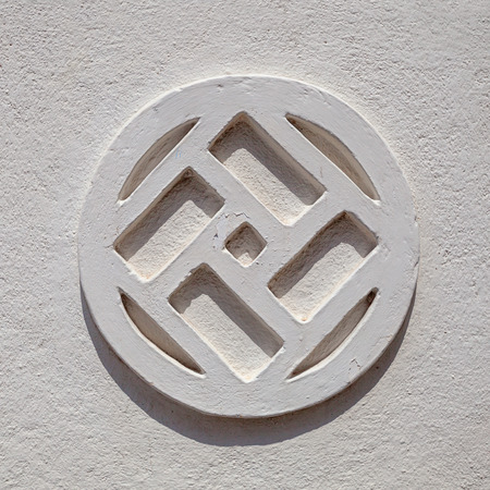 Sri Lanka - pattern on the grey wall in the shape of a swastikaの写真素材