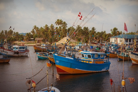 HIKKADUWA, SRI LANKA - CIRCA APR 2013: parking wooden ships of fishermen in marinaのeditorial素材