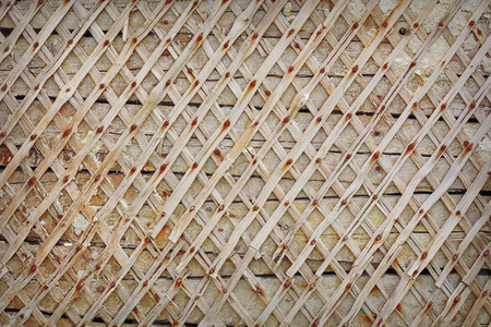 Wall with planks nailed. Rhombuses pattern. Background white wallの写真素材