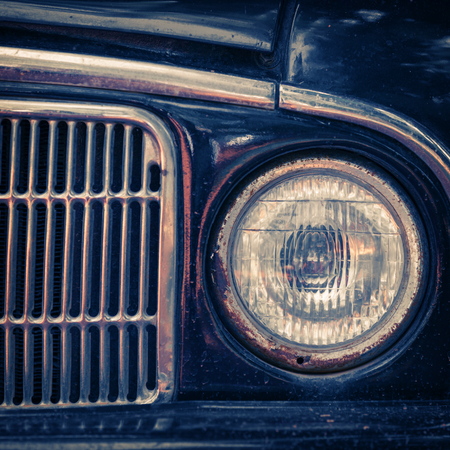 Old rusty car bumper and lamp. Close up shotの写真素材