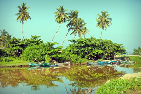 GALLE, SRI LANKA - CIRCA APR 2013: A small backwater with wooden boatsのeditorial素材