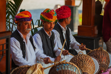 PUSHKAR, RAJASTHAN, INDIA - CIRCA NOV 2012: Musicians near luxury hotelのeditorial素材