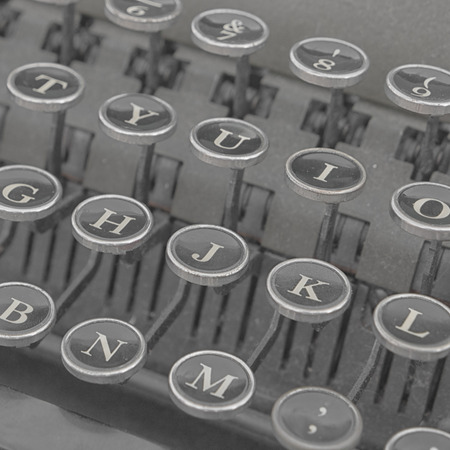 The keyboard of old typewriter. Black letters on the typewriter. Detail of a black vintage typewriterの写真素材