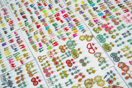 Laos - colorful jewelery for sale. On the white background. Handmade Earringsの写真素材