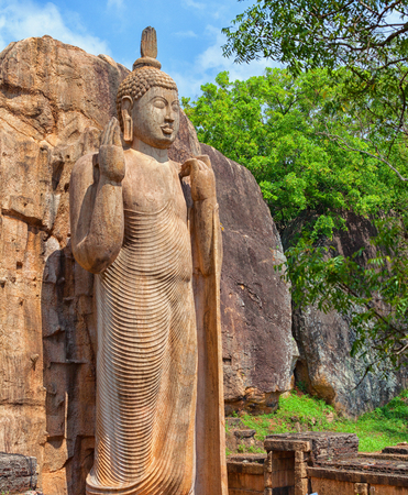 The Avukana statue is a standing statue of the Buddha. Sri Lanka. Vertical shotの写真素材