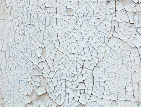 Old wall with white peeling paint. Grunge vintage backgroundの写真素材
