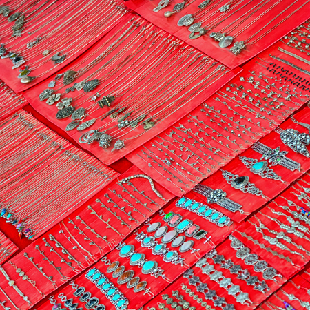 Necklaces and bracelets on the counter of a small shop. Laosの写真素材