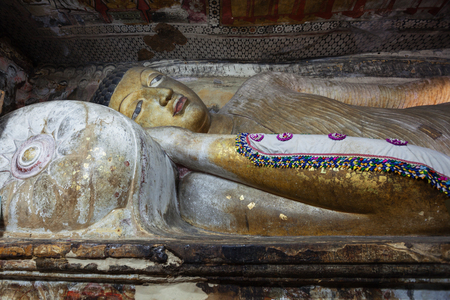 DAMBULLA, SRI LANKA - CIRCA APR 2013: in Dambulla cave Temple. The statue of reclining Buddhaのeditorial素材
