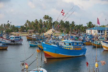 HIKKADUWA, SRI LANKA - CIRCA APR 2013: parking wooden ships of fishermen in marinaのeditorial素材