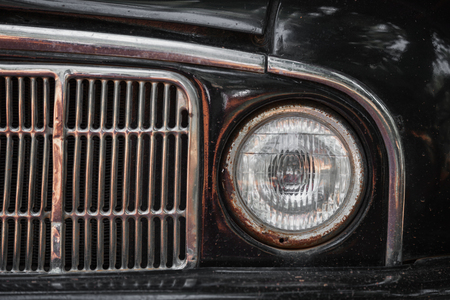 Old rusty car bumper and lamp. Close up shotの写真素材
