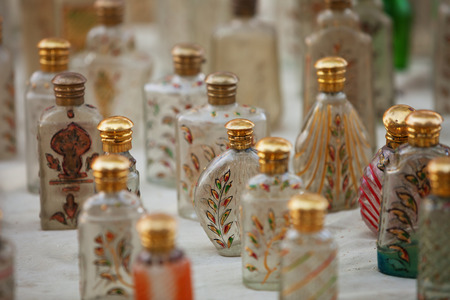 Small glass bottles for sale. The market in Indiaの写真素材