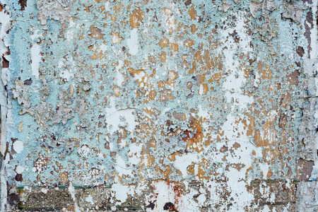 Dirty background - wall of an abandoned building with old paintの写真素材