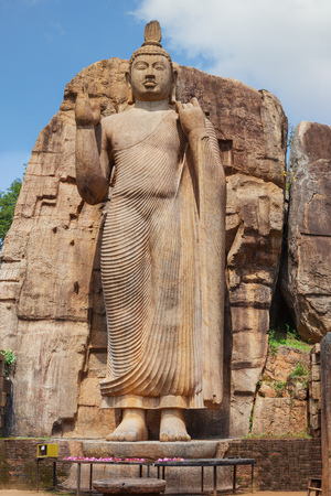 Big Buddha statue carved out of the rock near Aukana temple. Sri Lanka, Anuradhapuraの写真素材