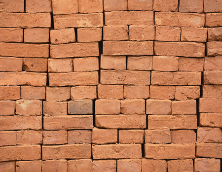 Stack of new red bricks. Architectural and construction backgroundの写真素材