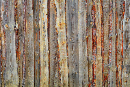 Substandard fence of  boards and slabs - backgroundの写真素材